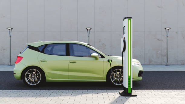 A green lemon electric car recharging at an electric charging station.